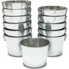 six metal buckets stacked on top of each other