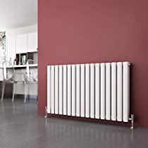 a room with a radiator, table and chairs next to a red wall