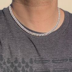 Men's Miami Cuban link hip hop chain. Solid 925 sterling silver with rhodium finish. Chain measures 18" inches by 6 mm thick. Has a good weight to it at 44 total grams. Fully micro paved high quality hand set cz. Features a stylish fully iced box clasp. You can take a shower with this chain on. Will not ever rust or turn your skin green. Buy confidently with our 30 day guarantee. 100% FREE SHIPPING in USA. Order now! Silver Necklace For Streetwear, Silver Link Jewelry For Streetwear, Silver Cuban Link Chain Necklace Iced Out, Silver Iced Out Cuban Link Necklace, Iced Out Silver Cuban Link Necklace, Silver Cuban Link Necklace For Streetwear, Silver Figaro Chain Necklace For Streetwear, White Cuban Link Chain Necklace, Silver Tennis Necklace Gift