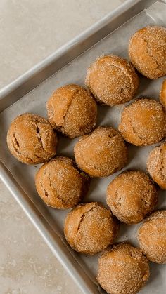 some sugary muffins are on a baking sheet