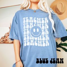 "Thank your favorite teacher for all their hard work with our teacher appreciation gifts. Our Comfort Colors teacher tee for women is a comfortable and stylish way to show your appreciation. ➭ How to Order 1. Choose your shirt size & color options. 2. Select the quantity. 3. Click \"Add to Cart.\" 4. Listen for a knock at your door! ➭ Care Instructions Wash your shirt inside-out in cold/warm water. Do not bleach or tumble dry. Instead, hang or lay flat to dry. ➭ Production & Shipping Processing Auntie Shirts, Teaching Shirts, Aunt Shirts, Baseball Mom Shirts, Usa Shirt, Teacher Tees, Cow Girl, Flag Shirt, Teacher Favorite Things