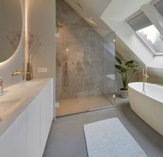 a bathroom with a skylight and a bathtub