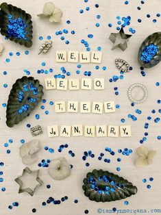 the words hello hello, hello there are blue and white confetti scattered around it