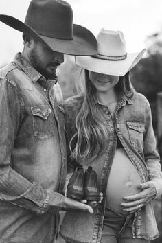 a pregnant woman wearing a cowboy hat next to a man