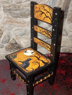 a wooden chair decorated with halloween decorations