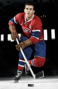 an old photo of a hockey player in red jersey and blue pants with a stick