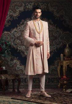 Rachit Khanna Turquoise | Light Peach Bird Detail Sherwani Set | INDIASPOPUP.COM Peach Sherwani Indian Groom, Pink Long Sets With Intricate Embroidery, Long Pink Sets With Intricate Embroidery, Pink Sets With Intricate Embroidery, Embroidered Peach Traditional Wear With Drape, Peach Embroidered Kurta For Wedding, Traditional Pink Sherwani With Intricate Embroidery, Ceremonial Anarkali Embroidered Sherwani, Anarkali Embroidered Sherwani For Ceremonial Occasions