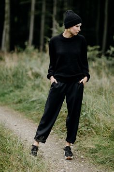 BOOI - black woollen trousers. The cut is quite wide. Tapered legs are ideal for rolling up and controlling the length this way. Rubber in the waist allows wearing the trousers both on the hips and in the waist. Pockets on the sides. The trousers are made of black wool that is slick and doesn't irritate the skin. They reflect light beautifully. Because of the addition of elana and lycra, the trousers don't crease easily and are easy to maintaint. Color: black Fabric: 100% wool Made in Belgium. Black Wool Pants For Winter, Black Wide Leg Pants With Loose Fit For Winter, Oversized Wide Leg Pants For Fall Workwear, Casual Black Wool Bottoms, Black Wool Pants For Fall, Black Wool Bottoms For Fall, Fall Season Wide Leg Trousers, Black Wool Wide Leg Pants, Black Wide Leg Pants For Winter Workwear