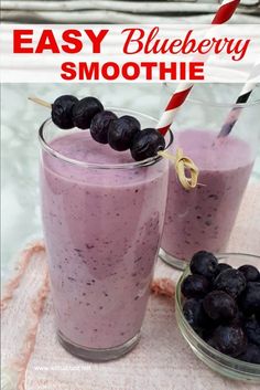 two glasses filled with blueberry smoothie on top of a towel