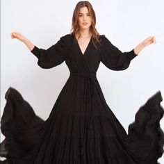 Black Maxi Dress, Long Sleeves With Gathered Cuffs, Overlapping V-Neckline, And Cut-Out Skirt. Fully Lined Skirt. 100% Rayon, Lining: 100% Rayon New With Tags, Size Xs, Fits True To Size Black Flowy Maxi Dress With Surplice Neckline, Black Flowy V-neck Maxi Dress, Flowy Black Maxi Dress With V-neck, Chic Black Maxi Dress With Surplice Neckline, Black Maxi Dress With Surplice Neckline For Fall, Black Flowy Dress With Surplice Neckline, Black Fitted Maxi Dress With Surplice Neckline, Maroon Gown, Silky Maxi Dress