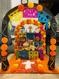 an altar decorated with flowers and decorations for a mexican day of the dead celebration,