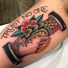 a close up of a person's arm with a tattoo on it that says first no one