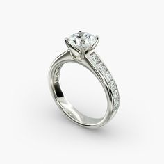 a white gold engagement ring with channeled diamonds