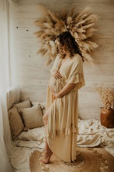 a woman in a dress standing on a rug