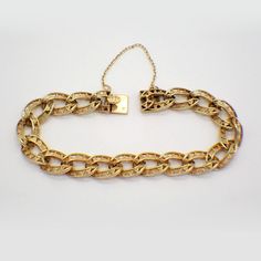 "Vintage French 18k (.750) yellow gold chain bracelet, made of wide open-work design oval form links with a box type closure and safety chain. This majestic bracelet is 7 1/4\" long, 9.8 mm wide and weighs 25 grams. EA3539" Luxury Gold Oval Link Bracelet With Box Chain, Luxury Oval Link Box Chain Bracelet, Luxury Gold Bracelet With Adjustable Oval Link Chain, Luxury Elegant Gold Oval Link Bracelet, Engraved Oval Link Yellow Gold Bracelet, Engraved Yellow Gold Oval Link Bracelet, Formal Gold Figaro Chain Bracelet, Formal Figaro Chain Bracelet With Oval Link, Engraved Link Yellow Gold Bracelet