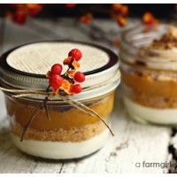 two jars filled with dessert sitting on top of a table