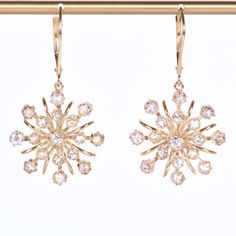 Whether you see starbursts, flowers or snowflakes, these fabulous antique dangling beauties will shimmer and sway with every step you take!  We call that a party for your ears and we know you will love wearing them for many, many years.  A full 1.80 carats of diamonds splay out from the centers of the earrings, displaying breathtaking sparkle! Antique Earrings - Antique 1930's 14k Yellow Gold Diamond Flower Dangle Conversion Earrings  14k Yellow Gold 1930's 35 Old European & Single Cut Diamonds Earrings Antique, Every Step You Take, Diamond Flower, Antique Earrings, Gold Diamond, Jewelry Earrings Dangle, Diamond Cuts, Dangle Drop Earrings