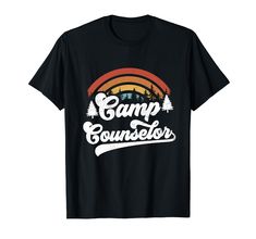 the camp counselor t - shirt is black and has an image of trees on it