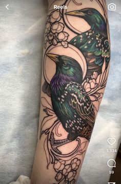 a black bird sitting on top of a person's arm with flowers around it