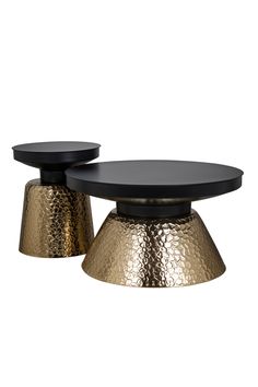 two black and gold coffee tables on white background