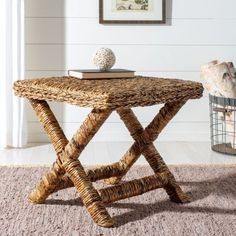 a small wooden table sitting on top of a carpeted floor