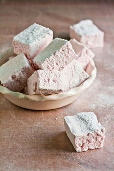 some pink and white marshmallows in a bowl