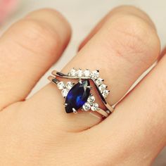 Gorgeous Vintage Inspired Marquise Royal Blue Sapphire Ring ►Made of solid sterling silver with rhodium finish (925) ►Accented With Simulated Diamonds (CZ) ►Average band width: 1.8 mm Center Stone: Sapphire Color: Royal Blue Shape: Marquise Measurements: 4.0 x 8.0 mm Carat Weight: 0.6 ct. (approx.) Gemstone creation: 100% Genuine Lab-Grown Hardness: 9-9.5 (Mohs scale) ►Matching band is sold separately: https://www.etsy.com/listing/932028239/chevron-wedding-band-sterling-silver?ref=shop_home_acti Classic Sapphire Ring With Marquise Cut, Classic Sapphire Marquise Cut Ring, Sterling Silver Marquise Promise Ring, Classic Marquise Birthstone Jewelry, Sapphire Cluster Ring In Sterling Silver For Wedding, Marquise Sapphire Wedding Ring As Birthstone, Classic Sapphire Wedding Ring With Birthstone, Classic Blue Stackable Wedding Rings, Sterling Silver Sapphire Ring Marquise Cut For Wedding