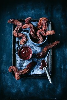 there are some fried food on the tray