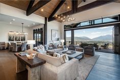 a living room filled with furniture and a large window