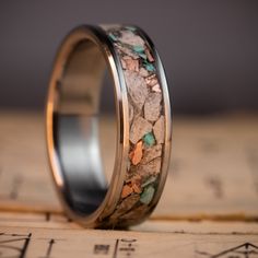 a wedding ring with rocks inlayed to it