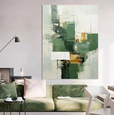 a living room filled with furniture and a painting on the wall above it's couch