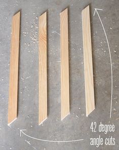 four pieces of wood sitting next to each other on top of a cement floor with measurements