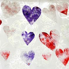 several hearts are painted in red, white and blue on a piece of paper with watercolor paint