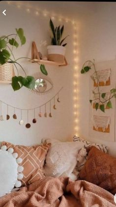 a bedroom with plants and lights on the wall