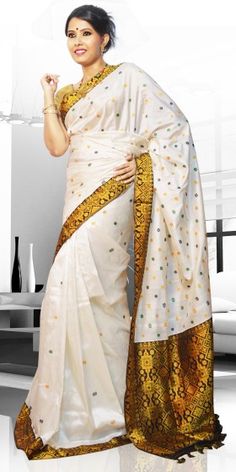 Beautiful White Colour Pat Guna Contrast Assam Silk Saree with artistic Guna work of small buta giving an unique look to the collection. This saree can be used as both wedding and festival Saree.The Saree comes with matching blouse piece, the blouse shown in the image is just for display purpose.Slight colour variation may be there in display & actual. White Colour, Beautiful Saree