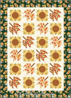 a quilted wall hanging with flowers and leaves in the center, on top of a green background