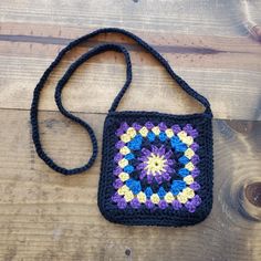 Not your grandma's granny square bag. This bag is filly lined. 7.5" Perfect size for your phone, sunglasses and keys. #grannysquare #bohochic #crochetproject #crochet #crochetbag Handmade Cotton Crossbody Shoulder Bag, Handmade Black Cotton Shoulder Bag, Granny Square Crochet Purse, Cross Body Bag Crochet, Body Bag Crochet, Boho Granny Square, Boho Cross, Granny Square Bag, Square Crochet