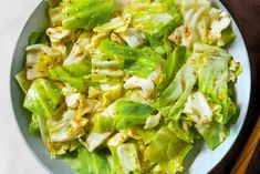 a bowl filled with lettuce and other vegetables