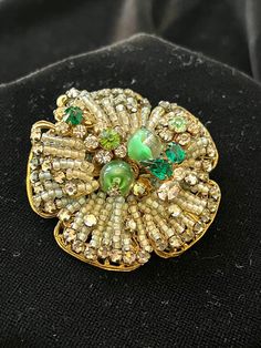 Meticulously Beaded Brooch with various shades of green rhinestones, some with clear swirls. Set on heavy filigree base. Signed Originals by Robert. Rare. Vintage Green Brooch For Evening, Antique Green Brooch For Evening, Vintage Green Evening Brooches, Vintage Green Evening Brooch, Ornate Green Jewelry For Evening, Green Brooch For Party, Formal Green Rhinestone Brooches, Elegant Green Rhinestone Brooches, Vintage Green Rhinestone Brooches