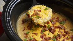 a crock pot filled with eggs and bacon