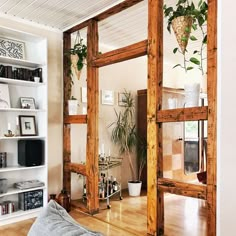 a living room filled with lots of wooden furniture