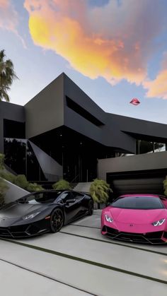 two pink and black cars parked in front of a building