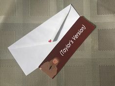 an envelope with a sticker on it and a pair of scissors sticking out of it