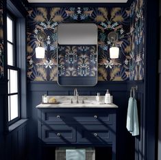 a bathroom with blue walls and floral wallpaper on the vanity, along with a large mirror