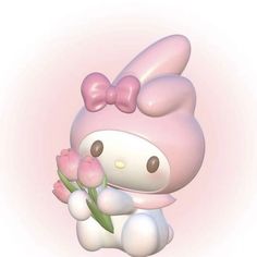 a cute little hello kitty holding some flowers