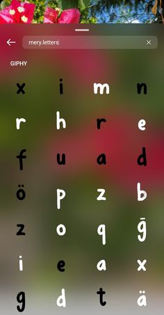 an image of a keyboard with flowers in the backgrounnd and letters on it