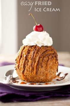 a piece of cake on a plate with whipped cream