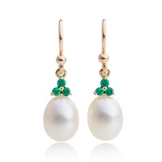 Made of yellow gold, these freshwater pearl earrings are embellished with sparkling emeralds. The timeless design provides an elegant touch to any attire. Freshwater cultured pearls, 9 x 8.5 mm. Emeralds, 0.22ctw. 14-karat yellow gold. Pierced only. Overall: 1"L Elegant Pear-shaped Emerald Earrings, Elegant White Gold Earrings For May Birthstone, Elegant Green Pearl Earrings For May Birthstone, Elegant Green Pearl Charm Earrings, Elegant Green Pearl Earrings With Charm, Formal Green Pearl Drop Earrings, Formal Pearl Drop Earrings For May Birthstone, Classic Pear-shaped May Birthstone Earrings, Classic Green Pearl Drop Earrings