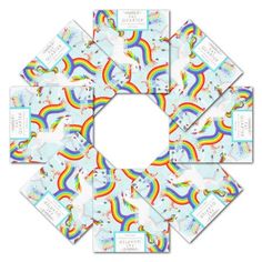 six square coasters with unicorns and rainbows in the middle, on white background