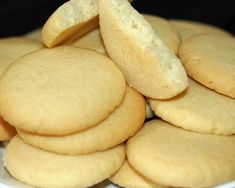 a white plate topped with cookies on top of a table